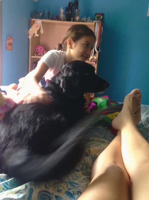 Claus comes into to find Kali on the bed.