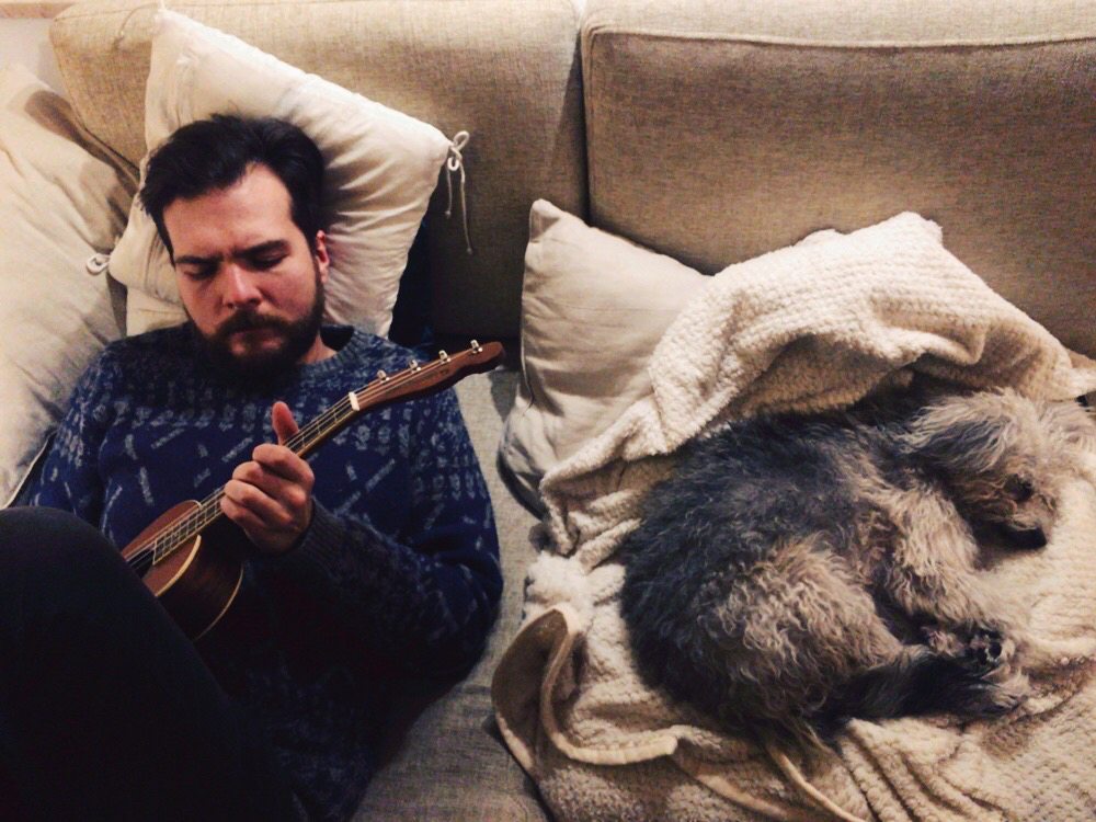 Playing sad ukulele songs for my dog, cause I don't know any happy ones
