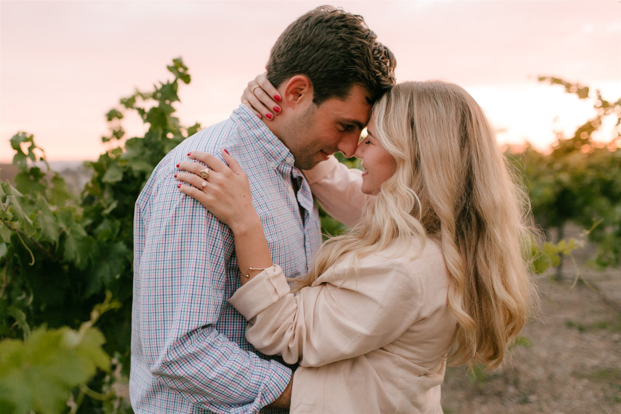 couple hugging in vineyard
