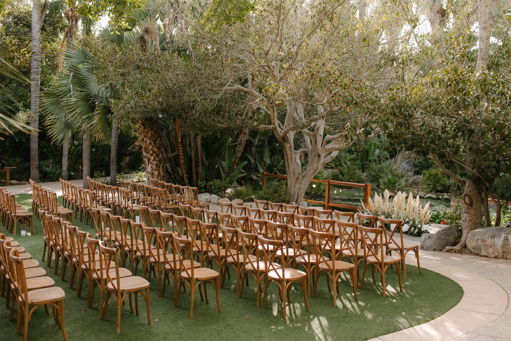 southern-california-wedding-venue-socal-garden-lush-greenery-san-diego-venue-palms-botanica-trademark-brown-crossback-chairs