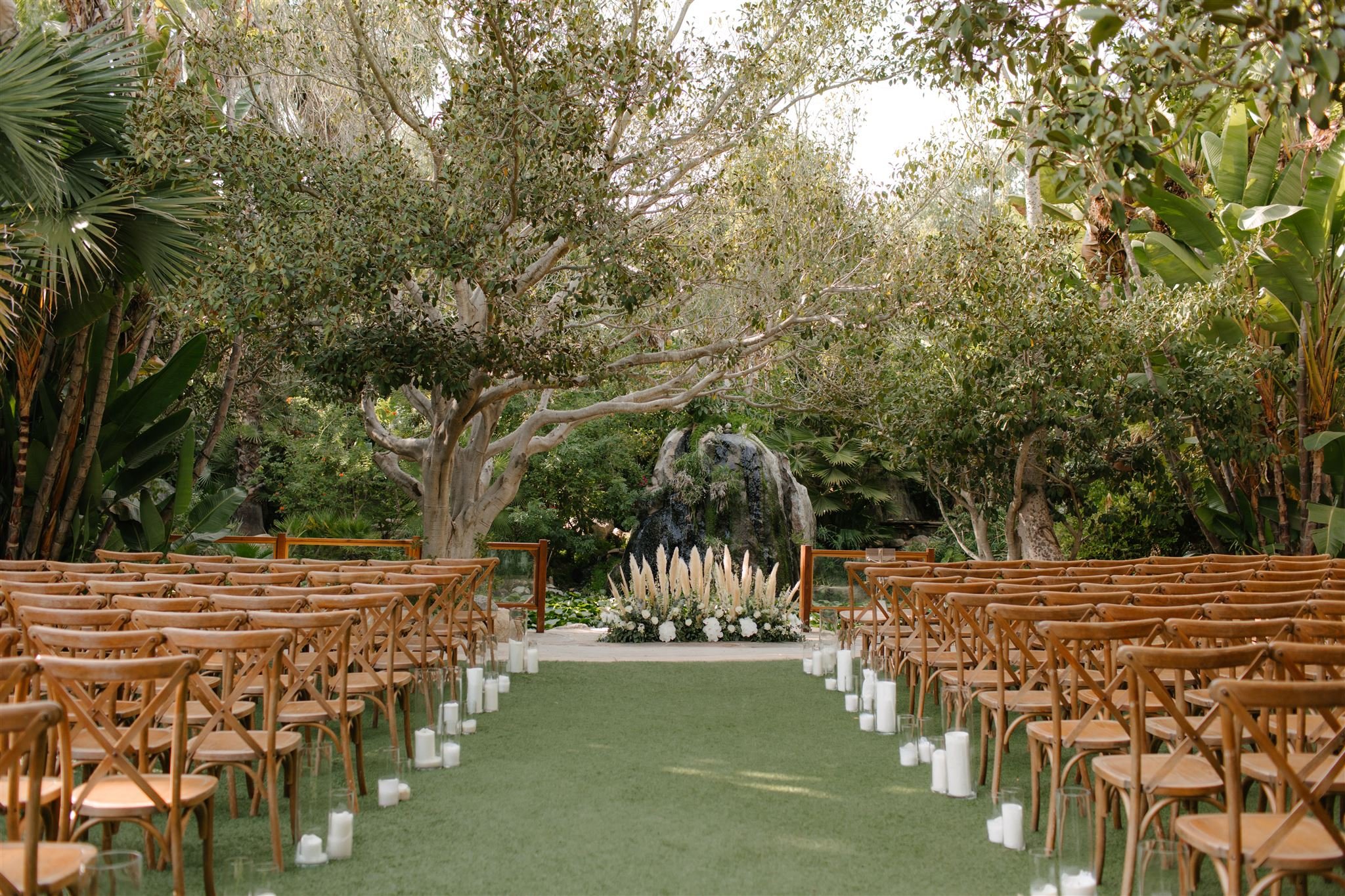 southern-california-wedding-venue-socal-garden-lush-greenery-san-diego-venue-palms-botanica-trademark-brown-crossback-chairs