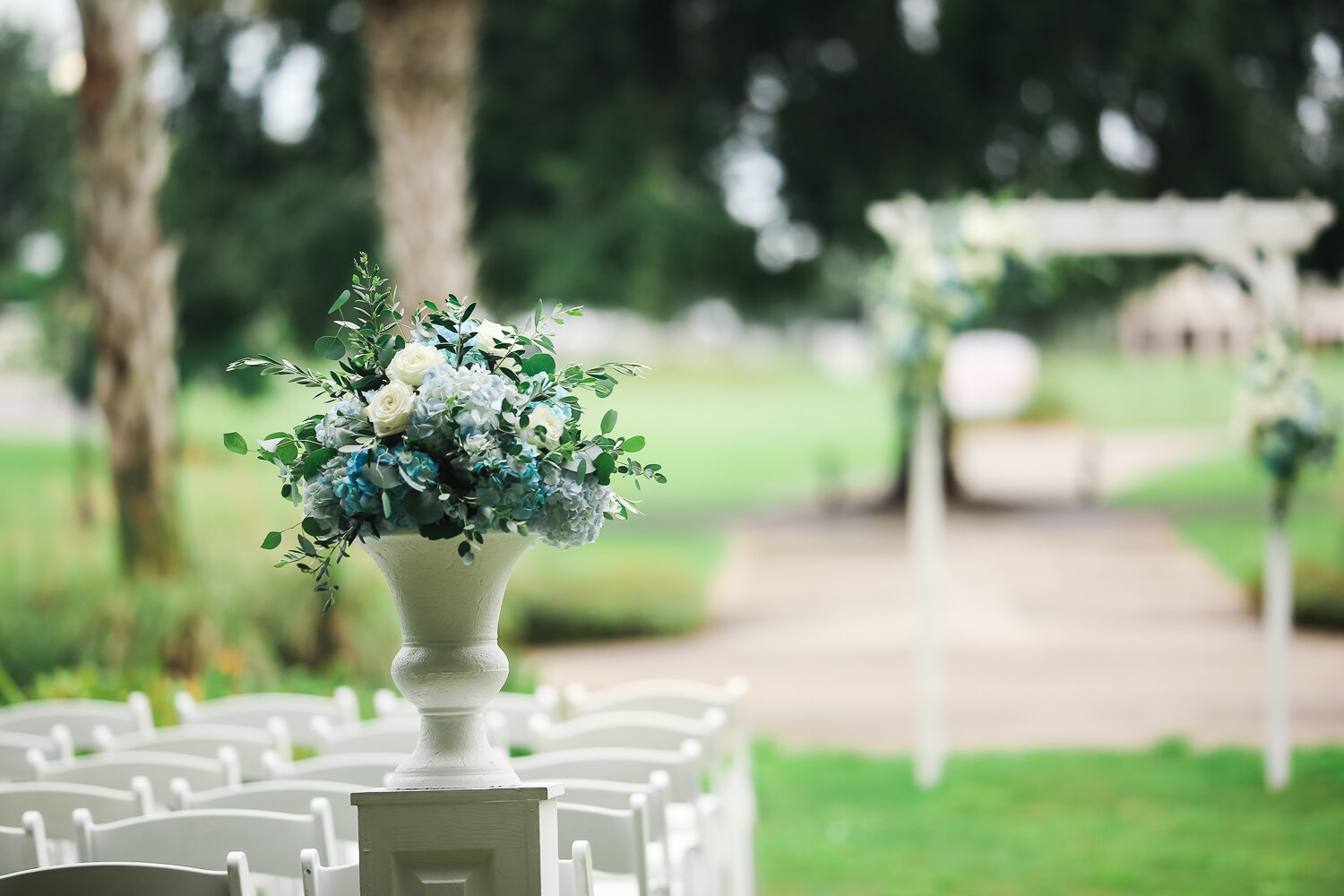 wedding flowers by altar