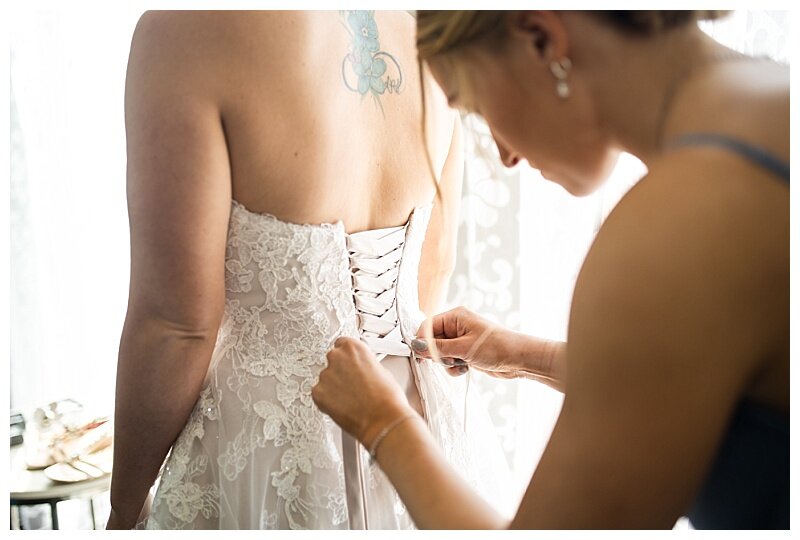 tying brides gown