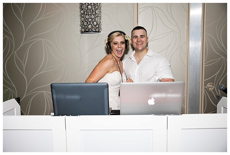 bride and groom at dj stand