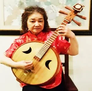 高星贞: 中阮演奏家。美中华人音乐家协会理事。