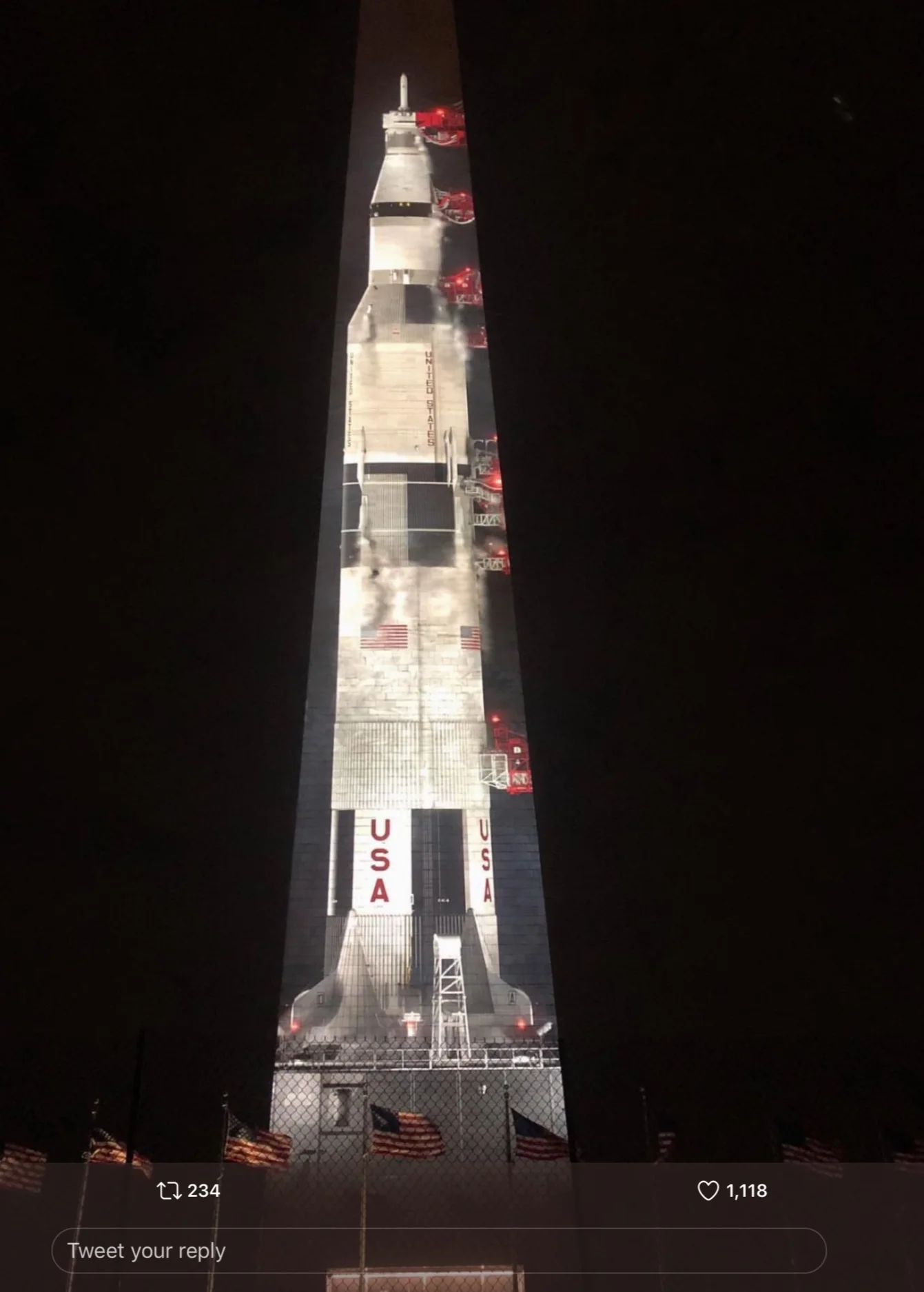 Saturn rocket with Apollo 11 crew projected on the Washington Monument for the 50th anniversary of moon landing.