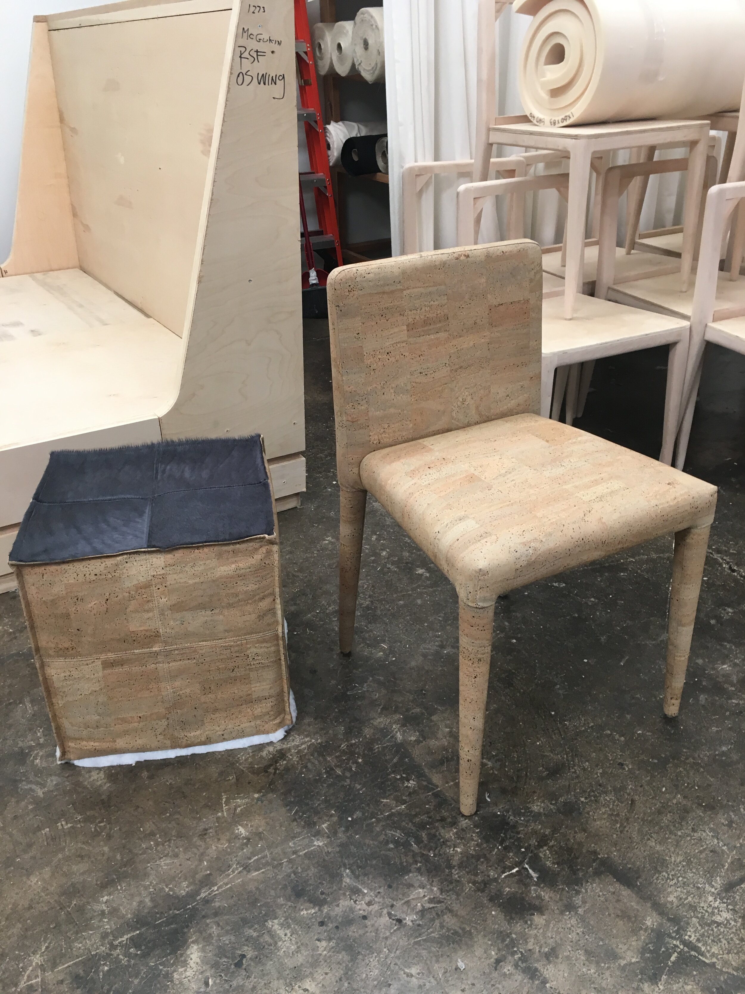  The first of 12 cork chairs. Ms. Bonasera created the master pattern and constructed the first to go by for the team to work from. Leather and cork quilted poof in progress, also patterned and constructed by Ms. Bonasera.   