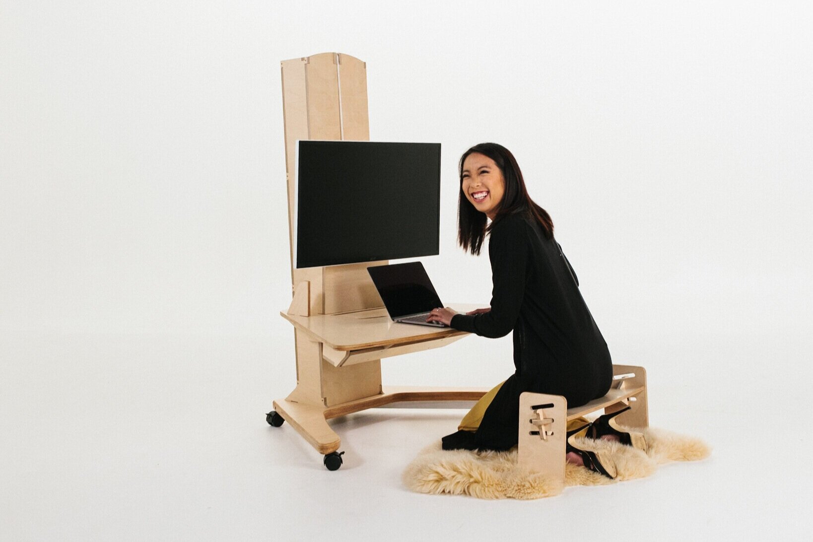 This is the low setup on a Limber Desk, supported by the Limber Stool to make floor positions more comfortable.