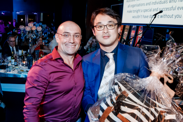 Carlo giving a prize.png