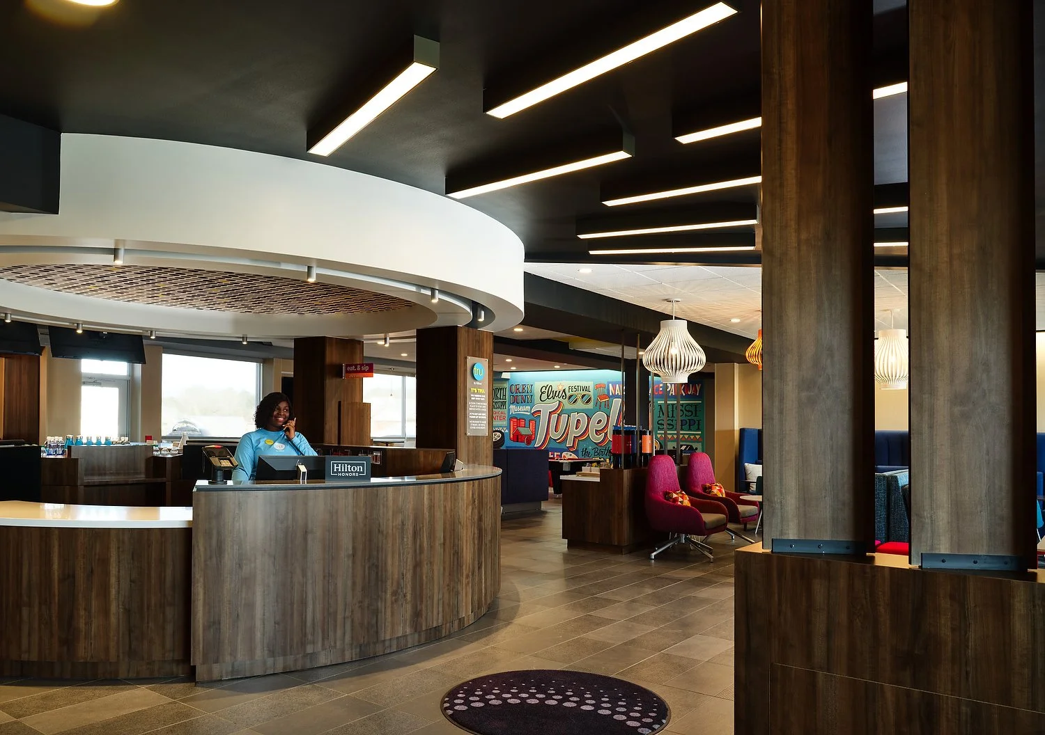 Tupelo front desk with personA-PATH.JPEG