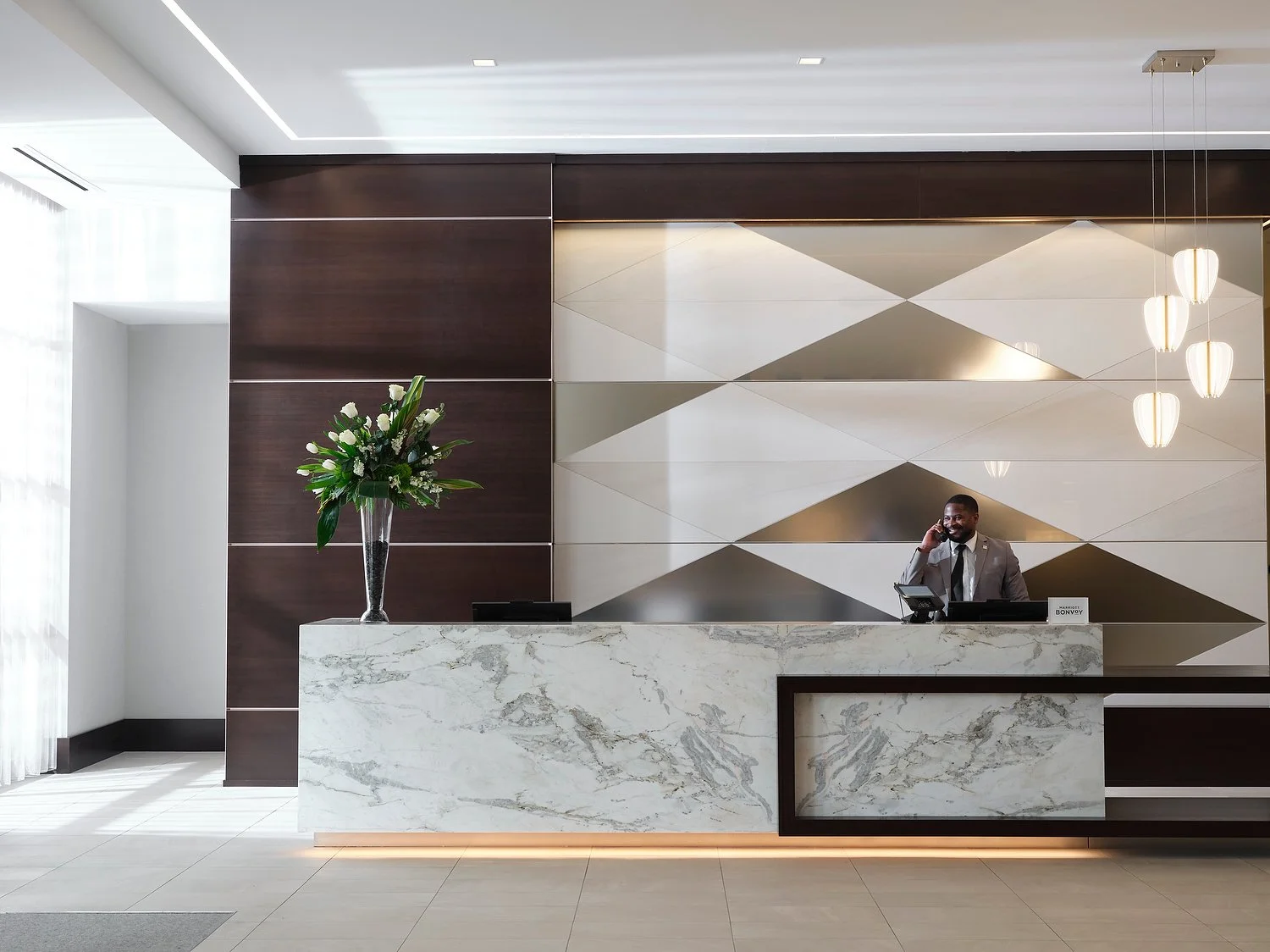 AC hotel front desk with employee 4.JPEG