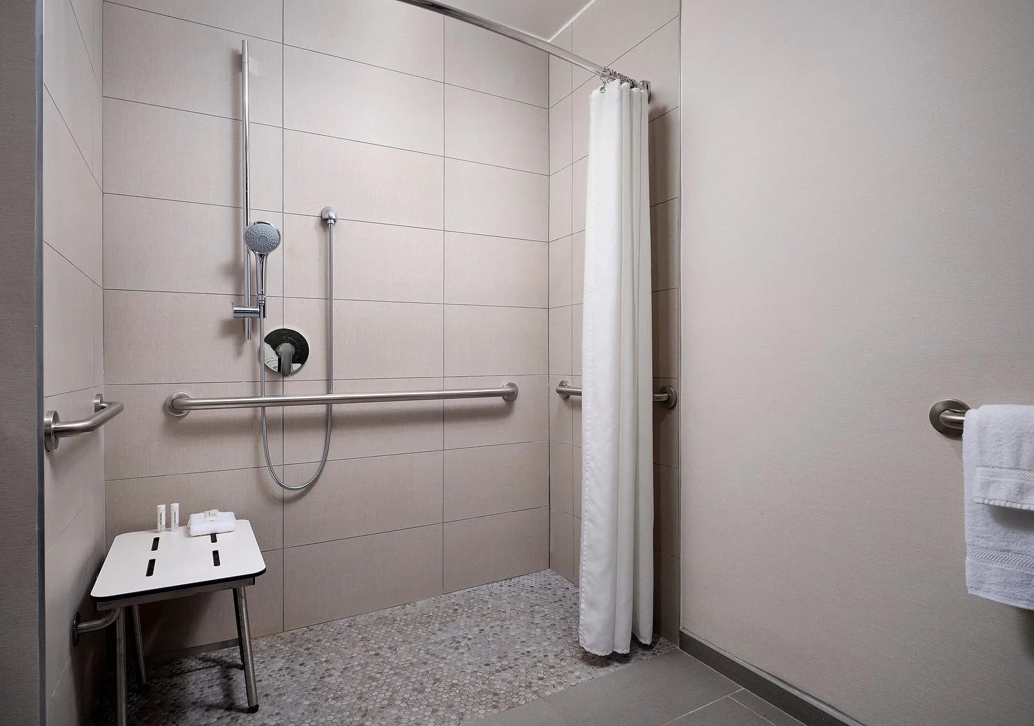 Grand Rapids Sheraton room103 ADA bath roll in.JPEG