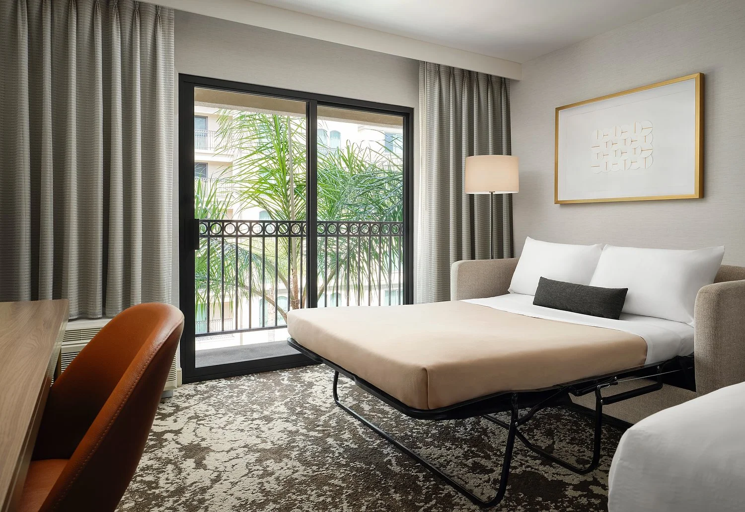 PASADENA COURTYARD room 412 king w balcony sofa bed v3.JPG