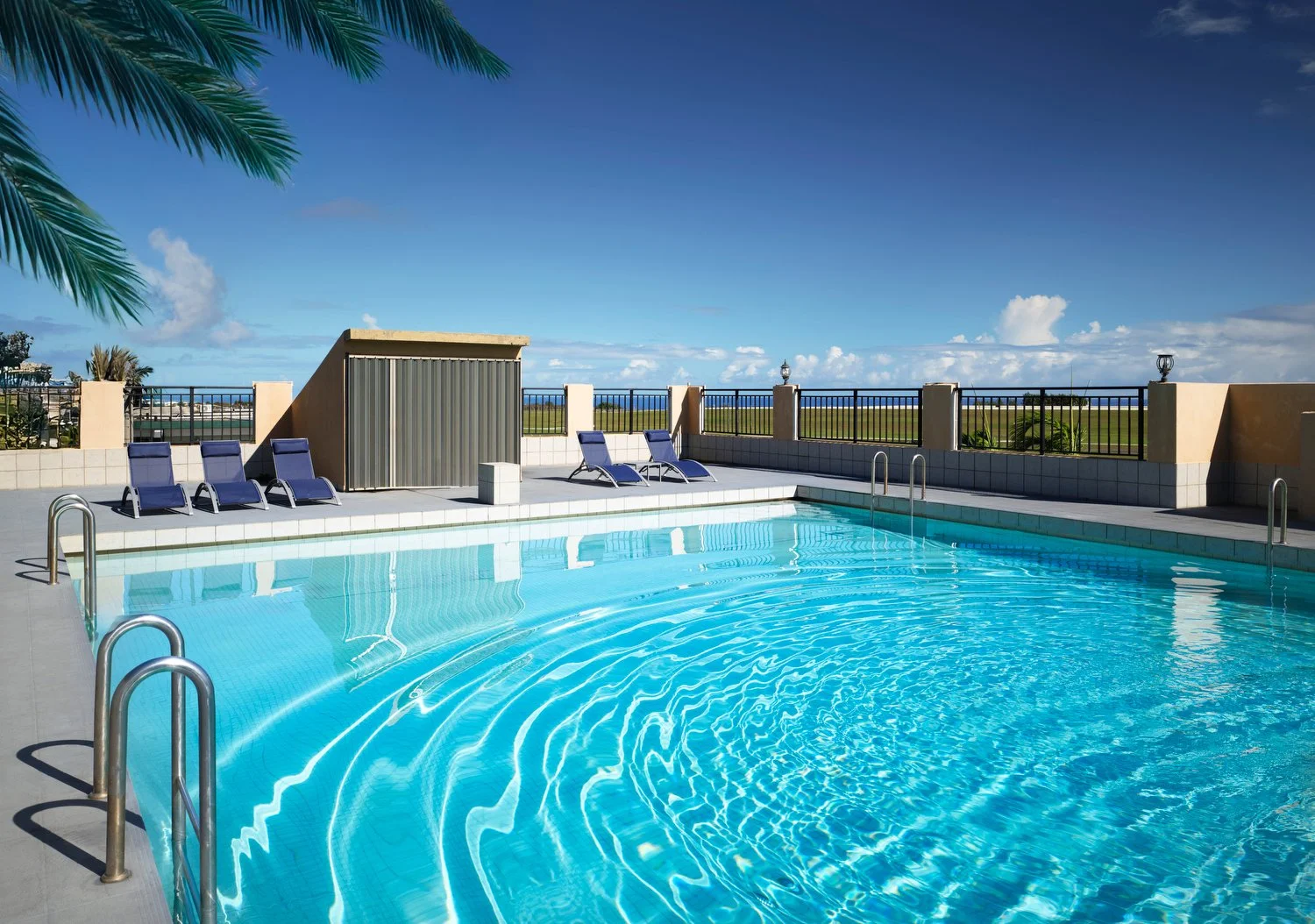 Guam Sure Stay pool alt palm.JPG