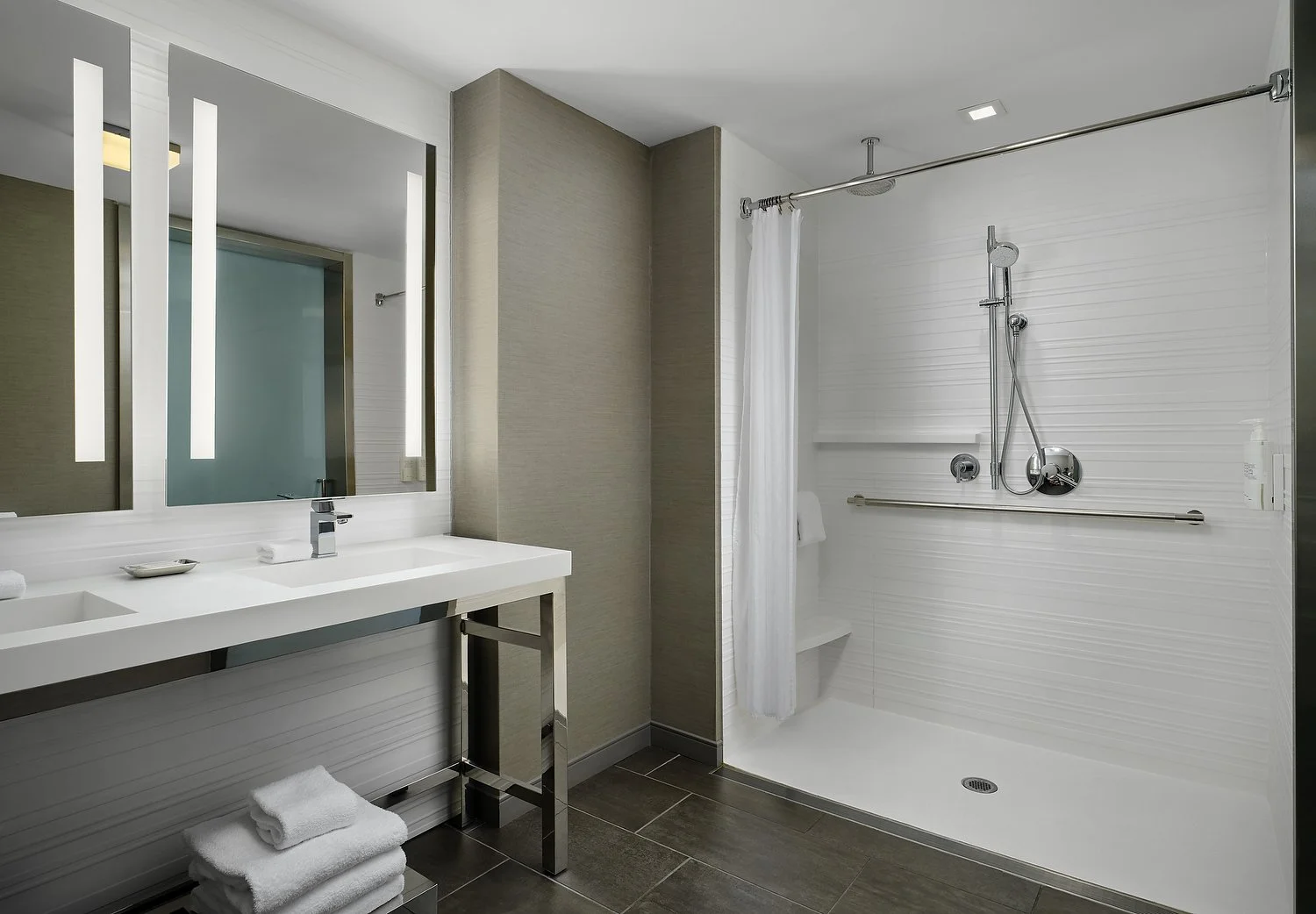 King one-bedroom suite 233 ADA feat. (233) roll-in shower.JPG