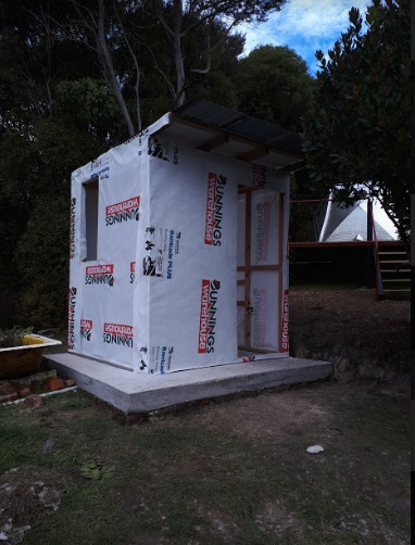 The building paper went on quickly and then we had to source the cladding.
