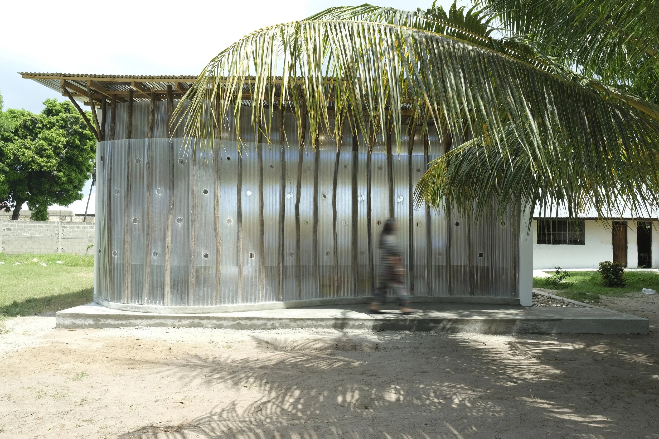   Location //  Kazole Village // Tanzania - Zanzibar   Category //  CSR Project   Area //  94.5 sqm   Project Year //  2025   In Collaboration // Lei Wa Lakom, Zain Telecome, Best Al Yousifi &amp; KEO   Lei Wa Lakom Library is part of the Parallel Gi