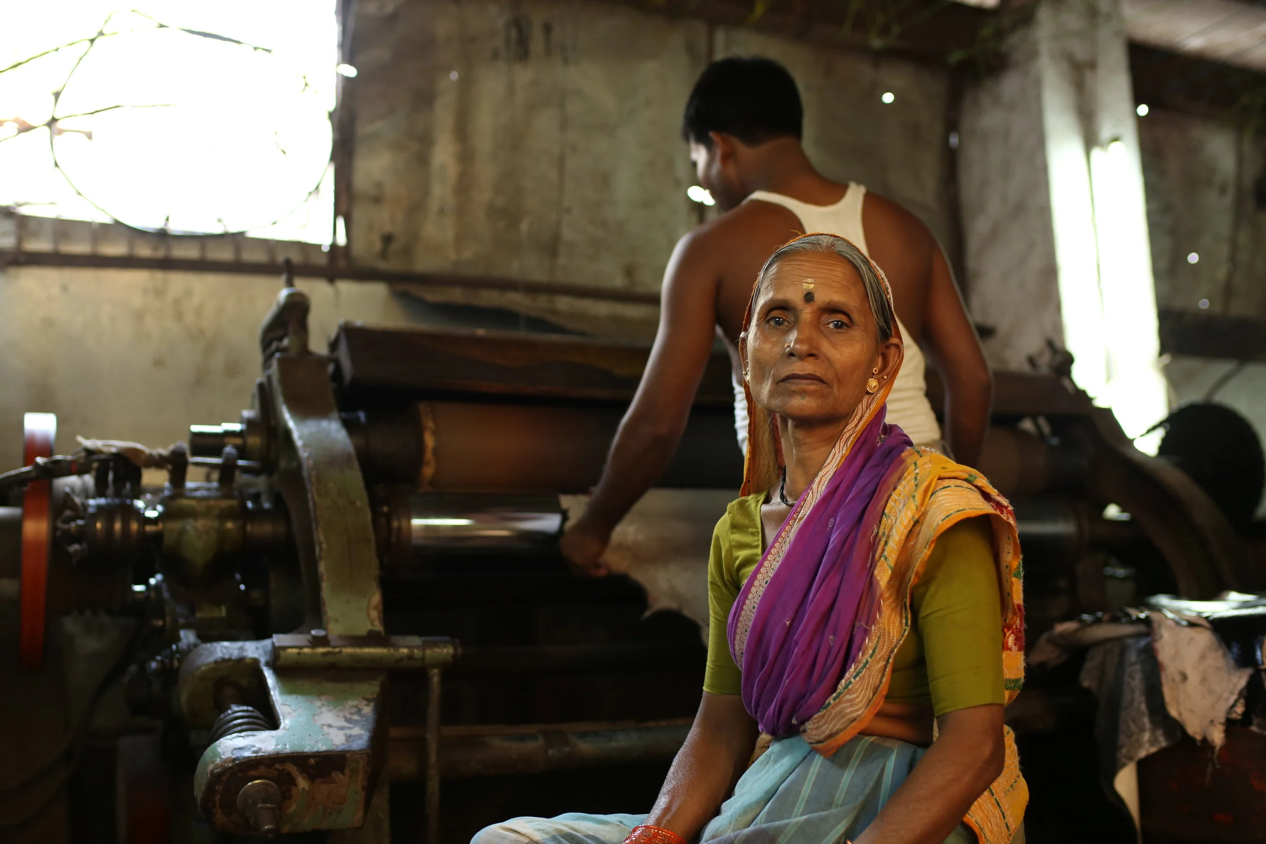  Leather workers, heat pressing the hides, this is the fourth stage of the process of readying the material for use. These workers earn under $8 a day and much of this leather (not originating from cows) gets sent to the western world for designer it