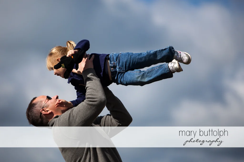 Father gives girl a lift at Tim's Pumpkin Patch