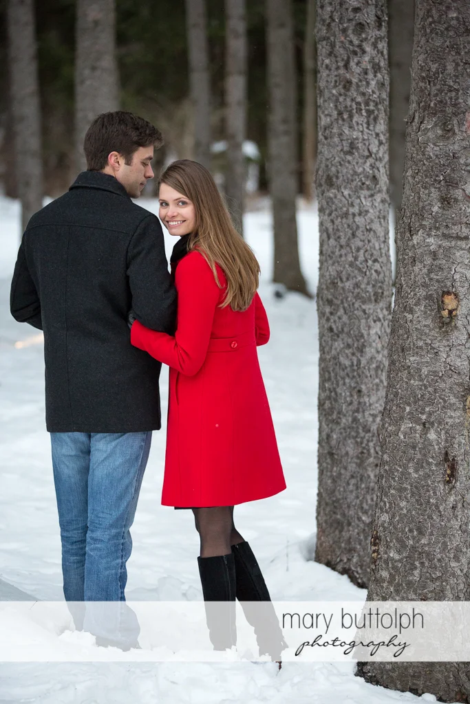 Couple stroll in the woods at Skaneateles Engagement