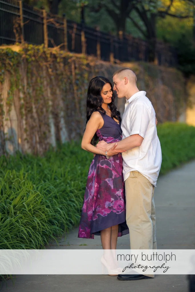 Couple pose on the walkway at Franklin Square Engagement