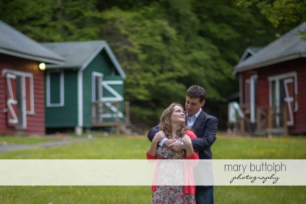 Couple have a quiet time near the cabins at Lourdes Camp Engagement