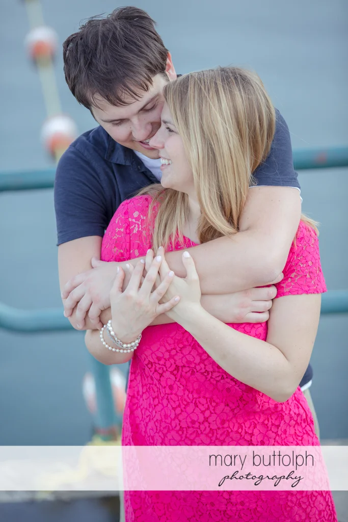 Couple share a tender moment at Green Lakes State Park Engagement