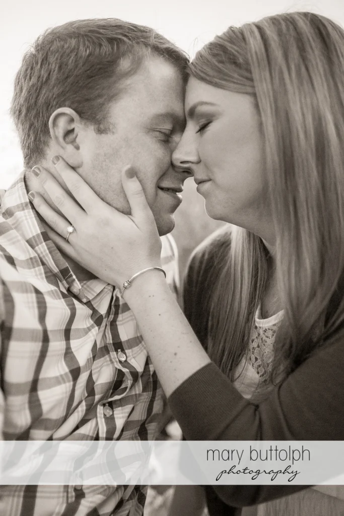 Couple show their affection in this dramatic black and white shot at Skaneateles Engagement