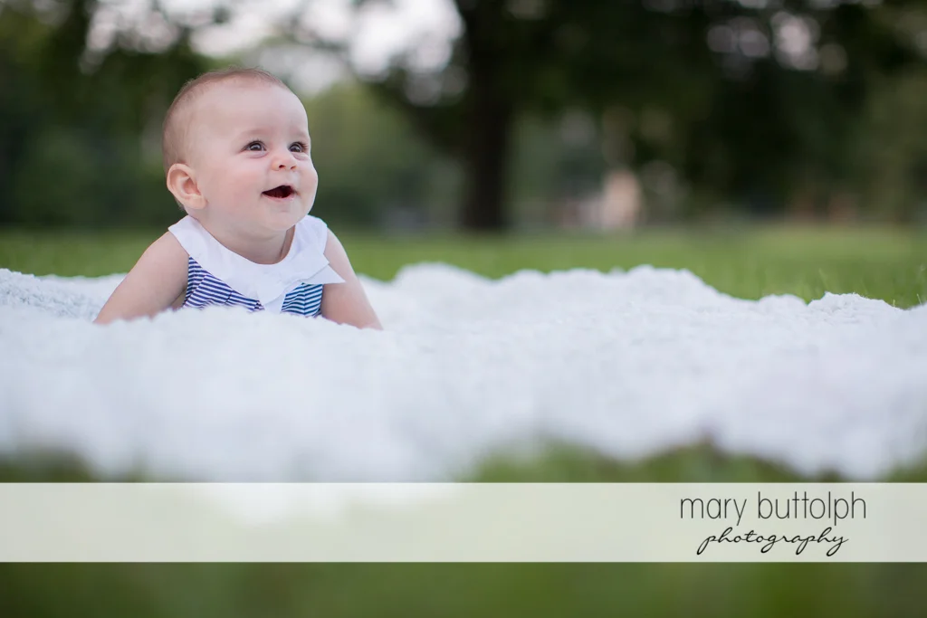 Baby sees something interesting in the garden at Skaneateles Family