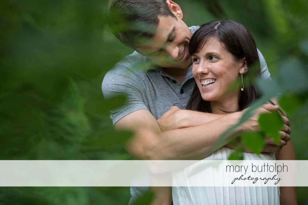Medium shot of couple in the garden at Skaneateles Lodge at Welch Allyn Engagement