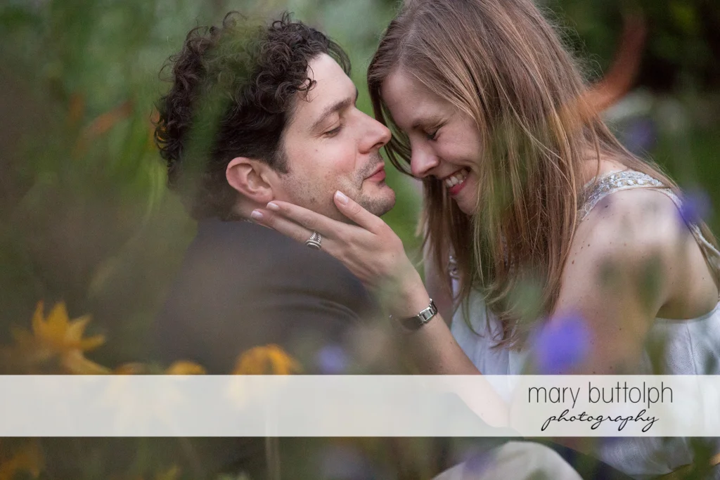 Couple relax in the garden at Skaneateles Engagement