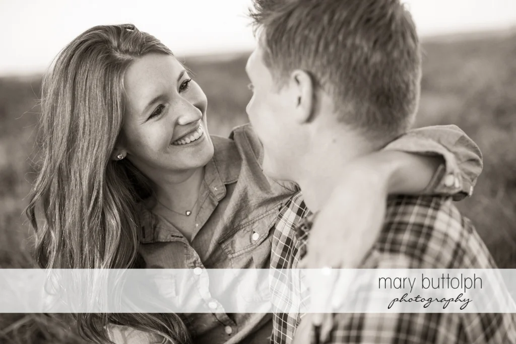 Couple share a light moment at Aurora Engagement