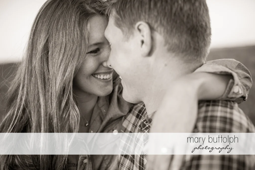 Couple rub noses in a nice black and white shot at Aurora Engagement
