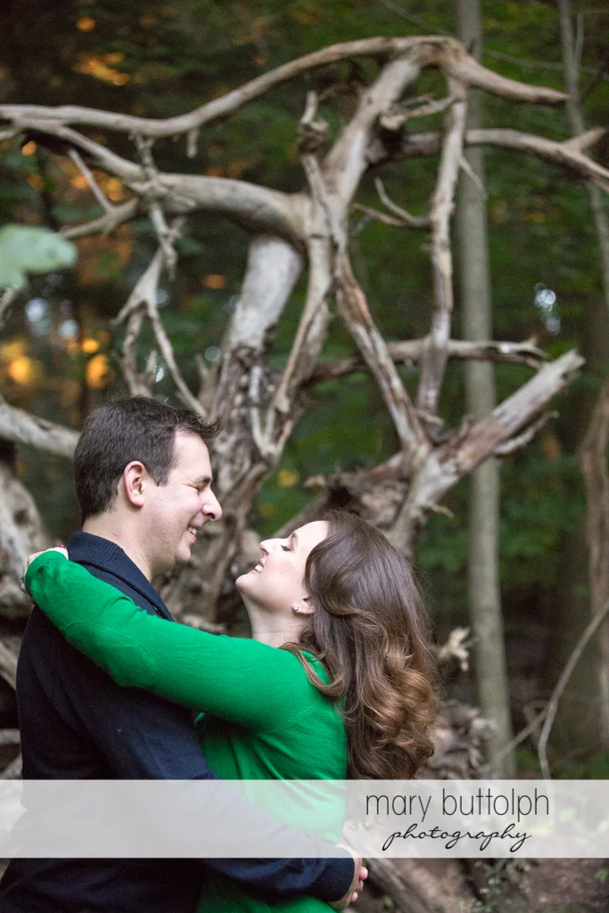 Couple spend time in the woods at Beaver Lake Nature Center Engagement