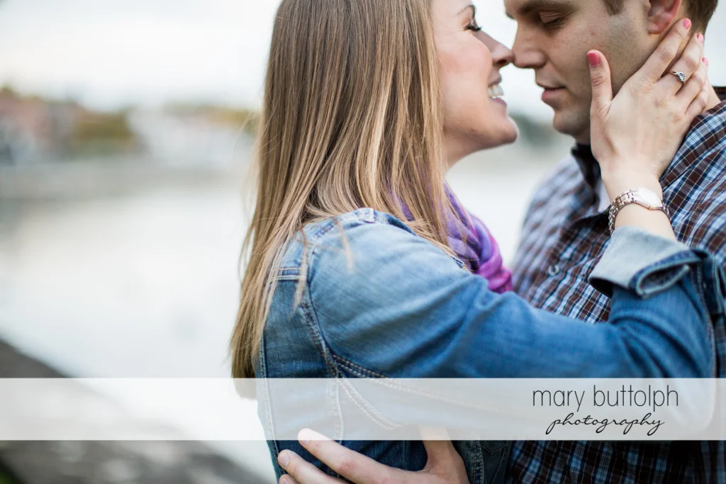 Couple rub noses at Skaneateles Engagement