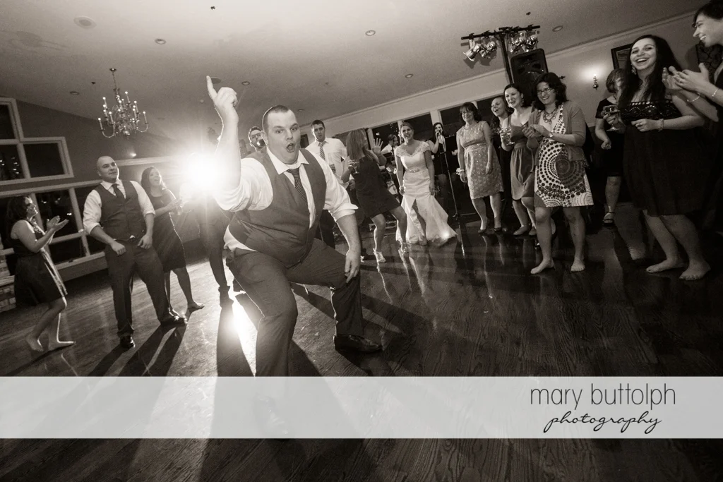 Gentleman having a great time on the dance floor at Traditions at the Links Wedding