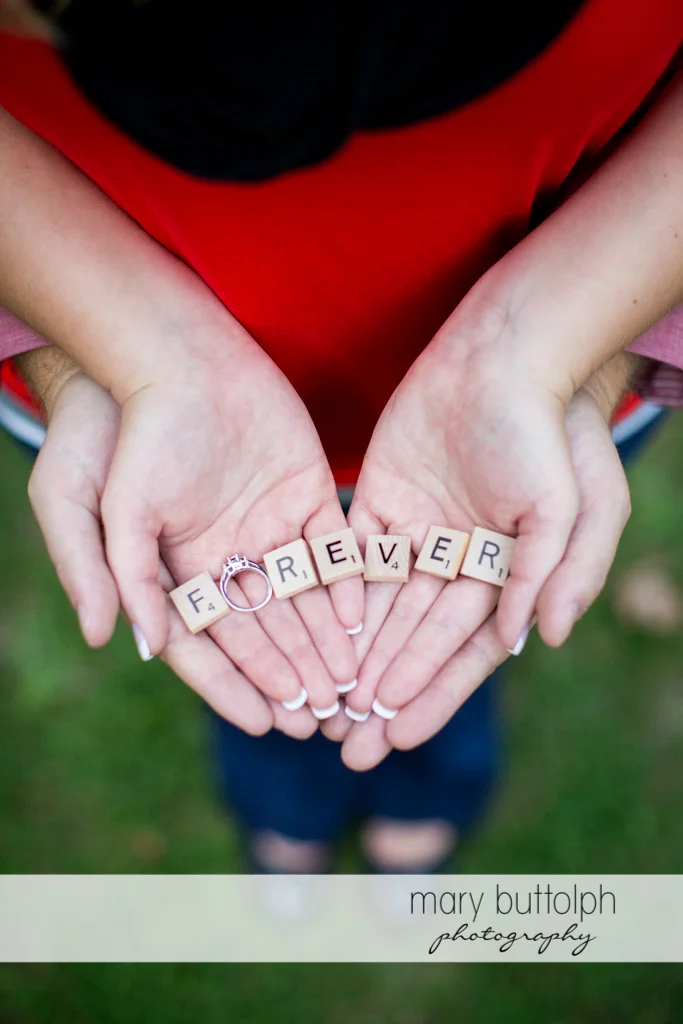 Couple spell out their love with the woman's engagement ring at Watkins Glen Engagement