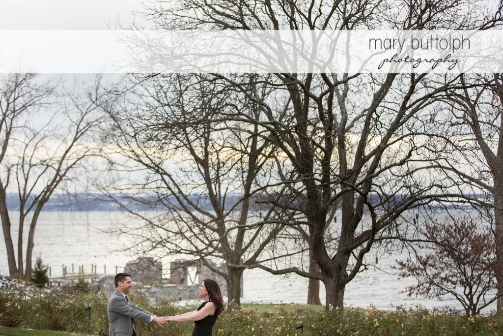 Couple in the garden overlooking the lake at the Aurora Inn Engagement