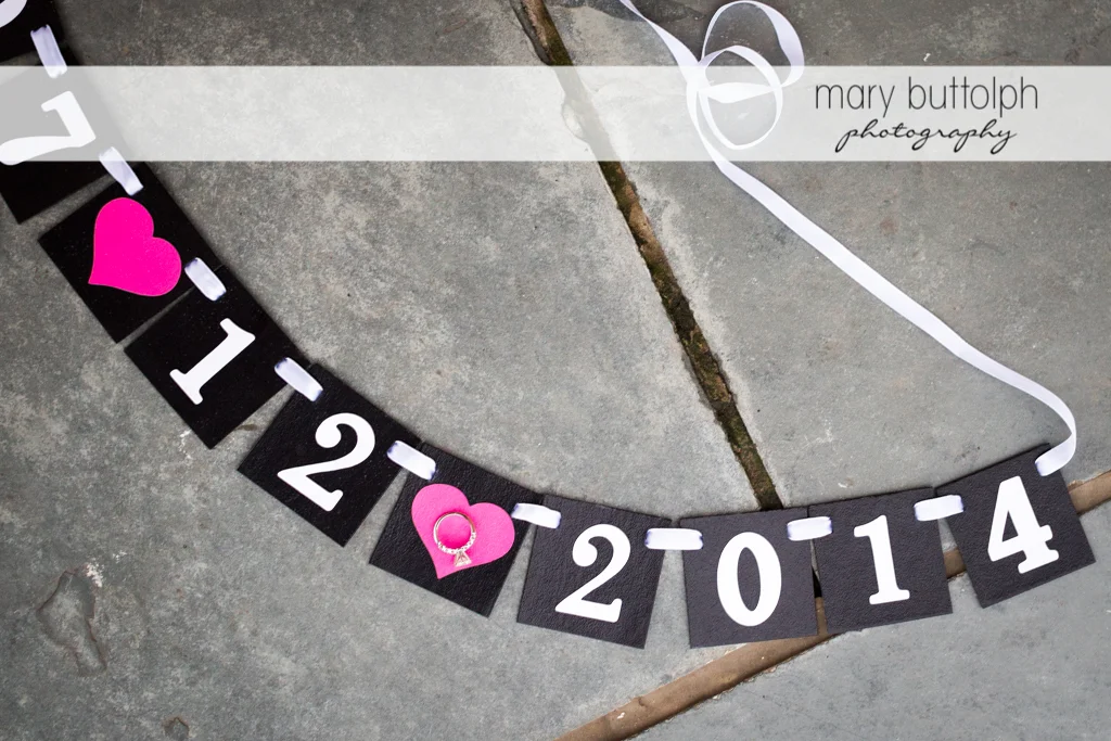 Necklace showing the couple's wedding date at the Aurora Inn Engagement