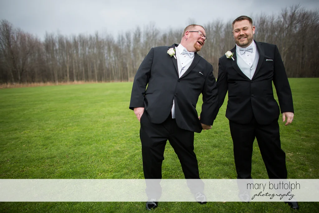 Same sex couple having a great time in the woods at Arrowhead Lodge Wedding