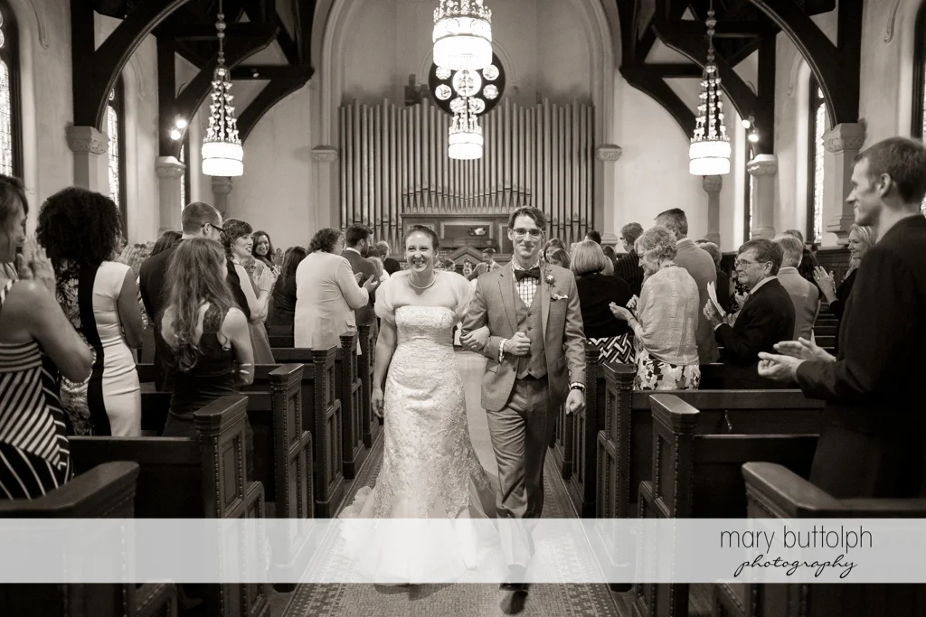 Couple leave church after the wedding at the Inns of Aurora Wedding