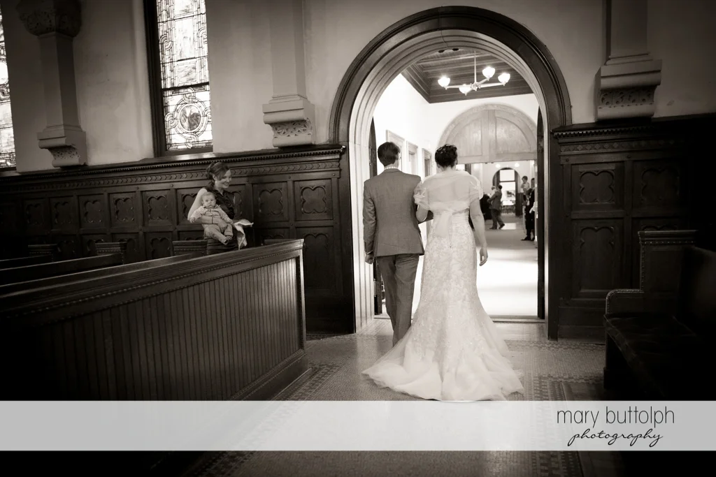 Back view of the newly married couple at the Inns of Aurora Wedding