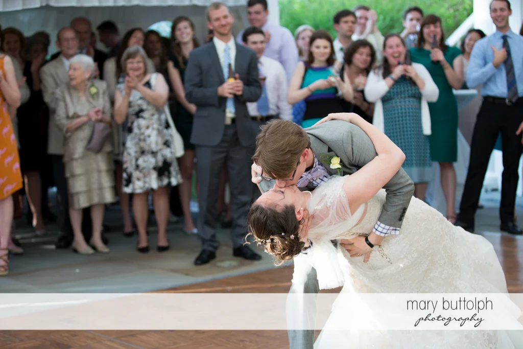 Couple kiss in front of guests at the Inns of Aurora Wedding