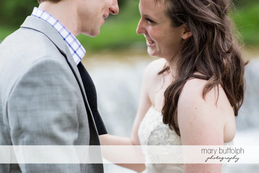 Happy couple share a quiet moment at Taughannock Falls Wedding