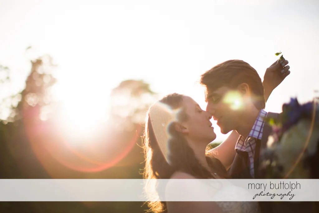 Couple kiss under the sun at Taughannock Falls Wedding