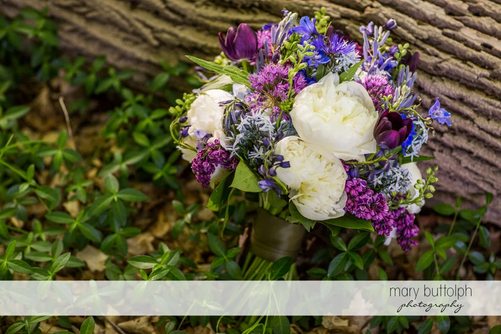 Bride's beautiful bouquet in the woods at Taughannock Falls Wedding