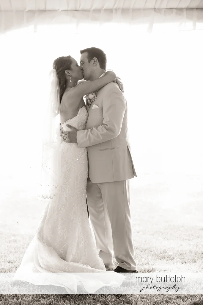 Couple kiss after the wedding at the Inns of Aurora Wedding