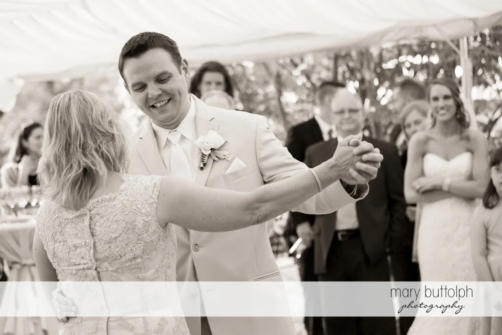 Groom dances with the bride's mother at the Inns of Aurora Wedding