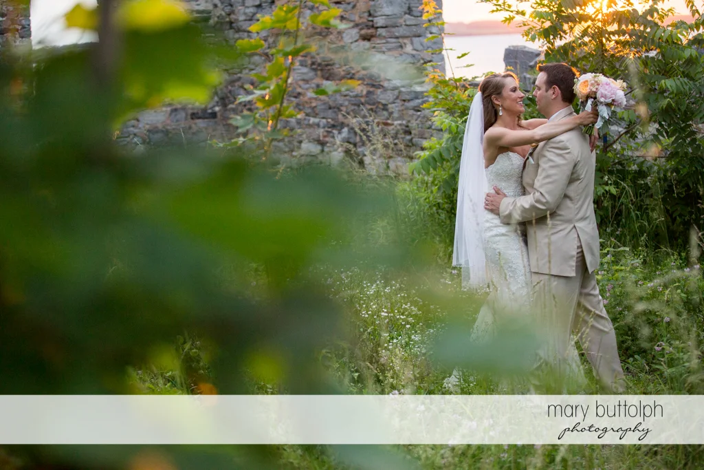 Couple embrace near the ruins at the Inns of Aurora Wedding