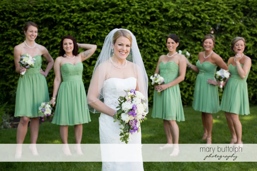 Bride and her bridesmaids in the garden at Emerson Park Pavilion Wedding